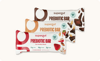 A Supergut Chocolate Brownie, Strawberry Almond, and Penaut butter Prebiotic Bar package displayed